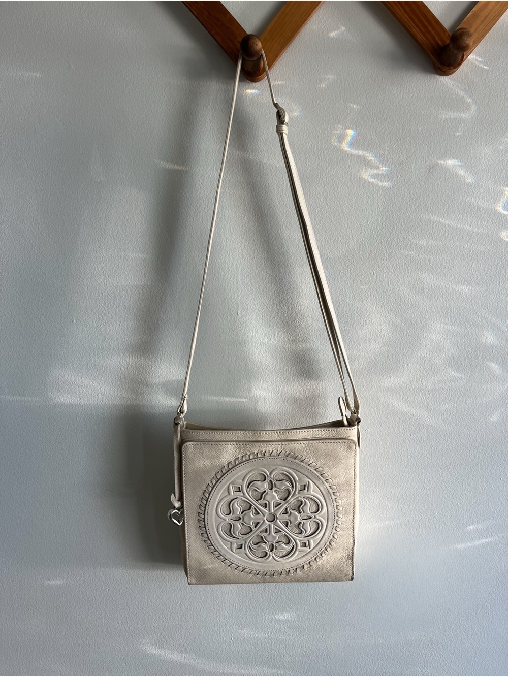 Brighton Cream Crossbody Bag with Decorative Medallion - Picture 2 of 6
